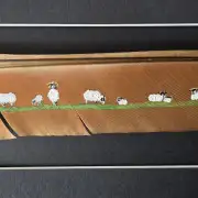 Flock of sheep painted on a peacock feather image 1