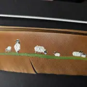Flock of sheep painted on a peacock feather image 3
