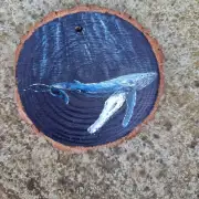 Humpback whale on wood slice image 1