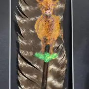 Heilan coo painted on a buzzard feather image 1