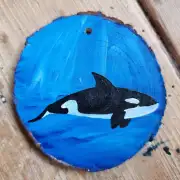 Orca on wood slice image 1