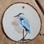 Heron on wood slice image 1