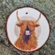 Heilan coo on wood slice image 1