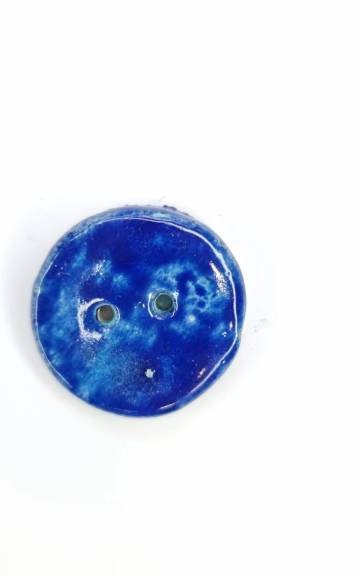 Ceramic button