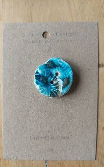 Ceramic button