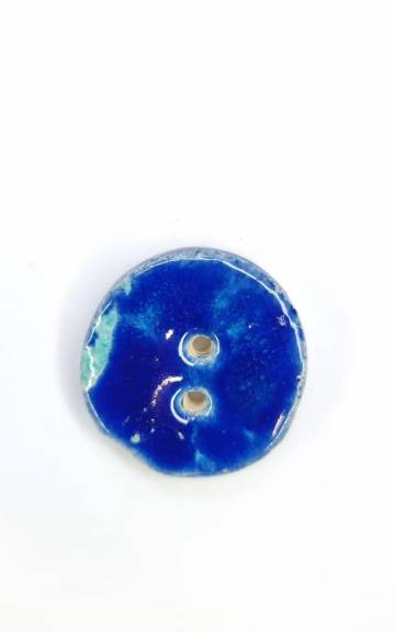 Ceramic button