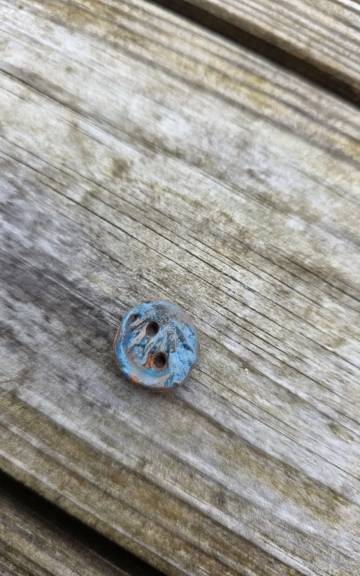 Ceramic button
