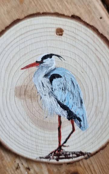 Heron on wood slice