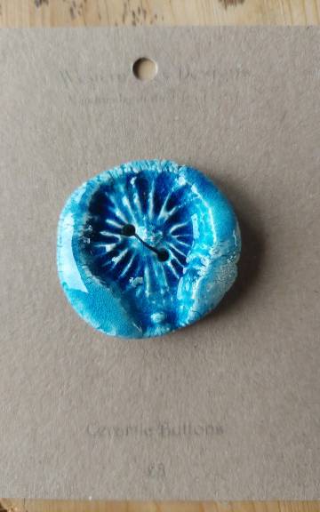 Ceramic button