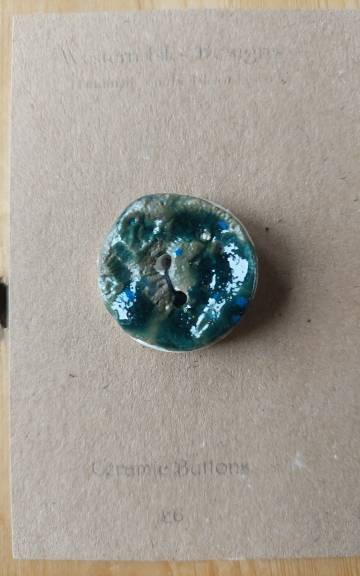 Ceramic button