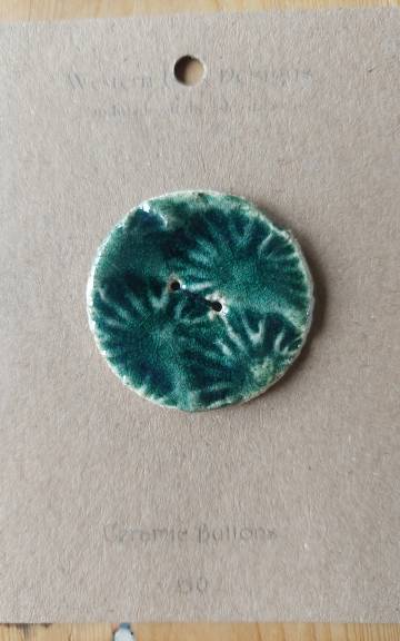 Ceramic button
