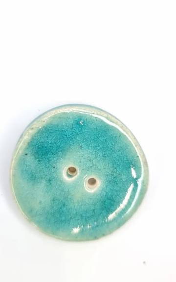 Ceramic button