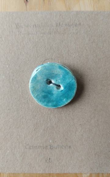 Ceramic button