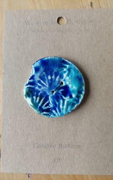 Ceramic button