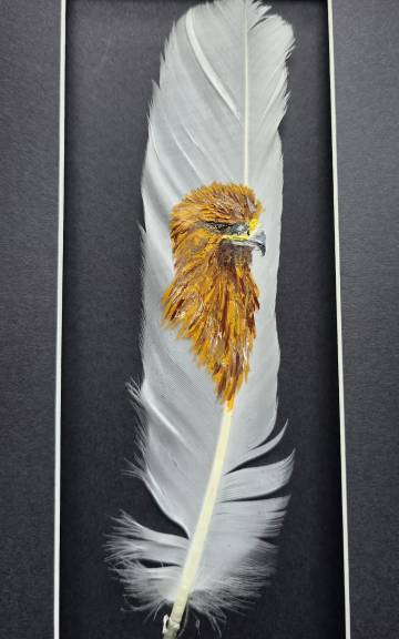 Golden eagle painted on a goose feather
