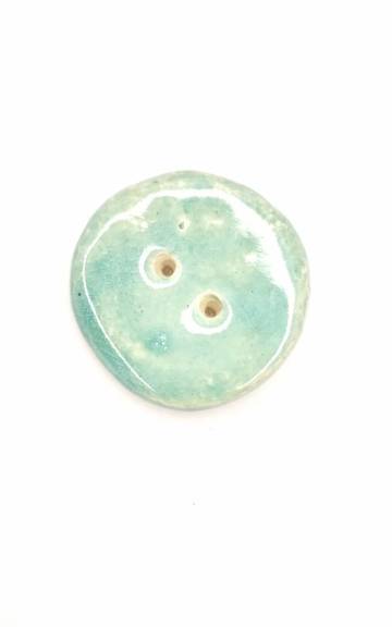 Ceramic button
