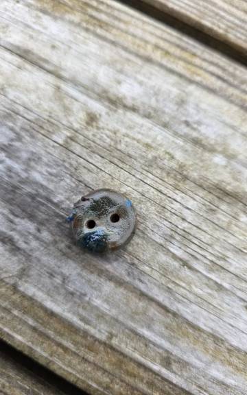 Ceramic button