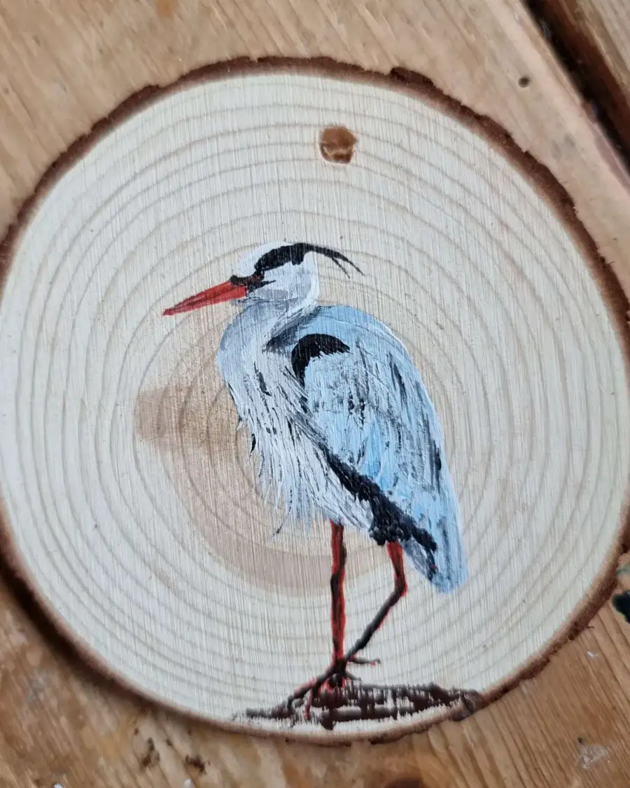 Heron on wood slice