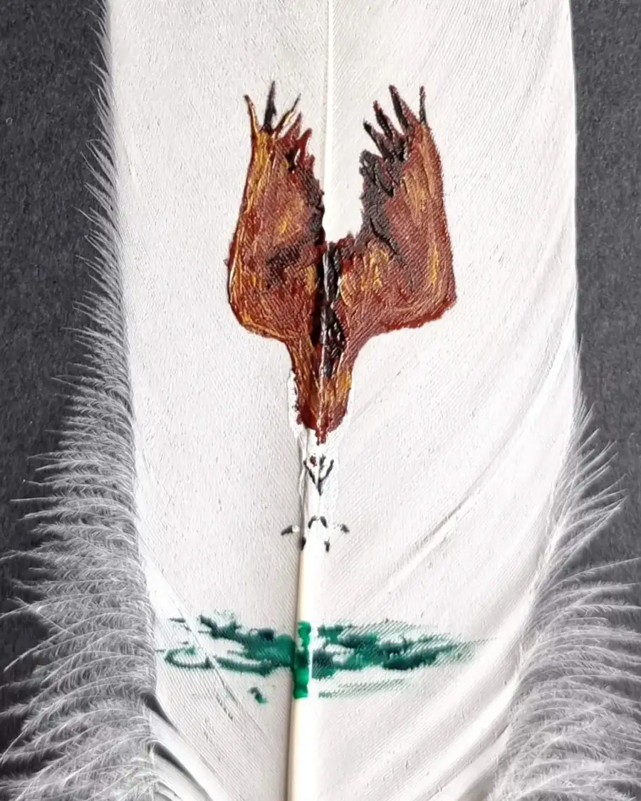 Diving osprey painted on a goose feather