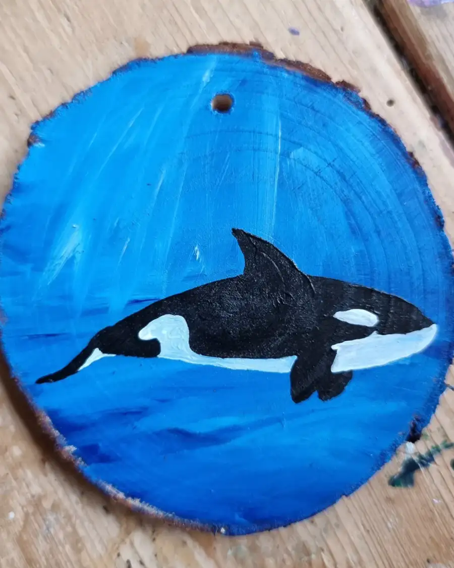 Orca on wood slice