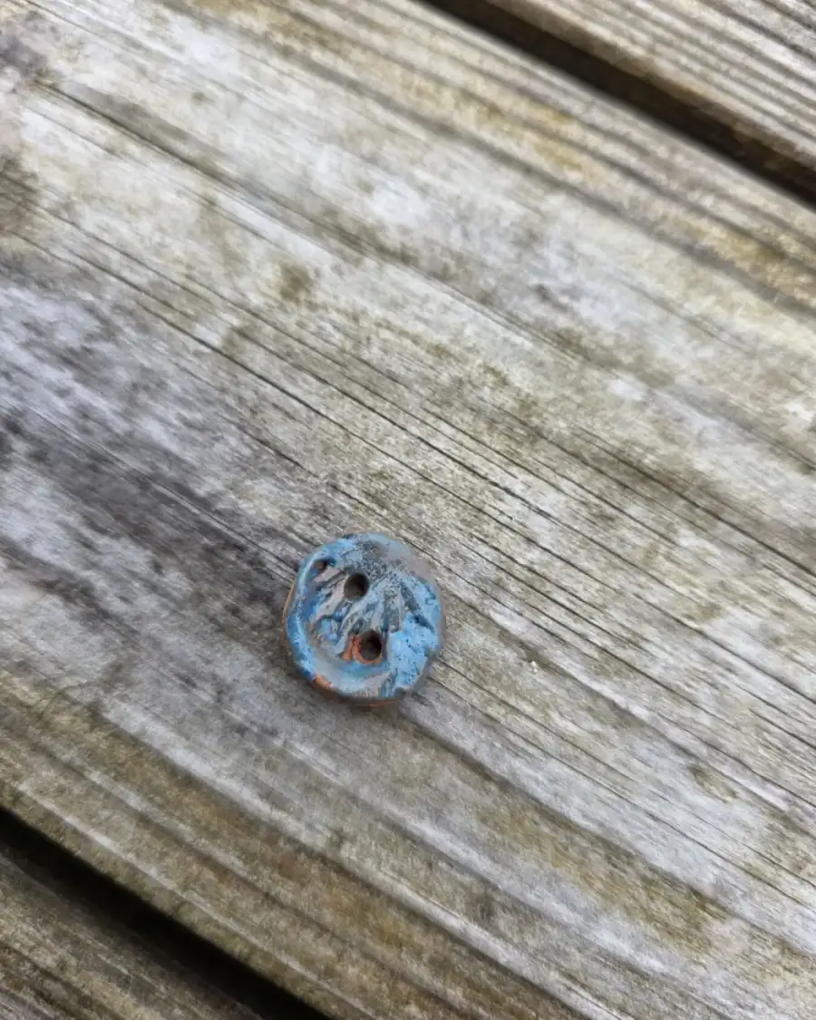 Ceramic button