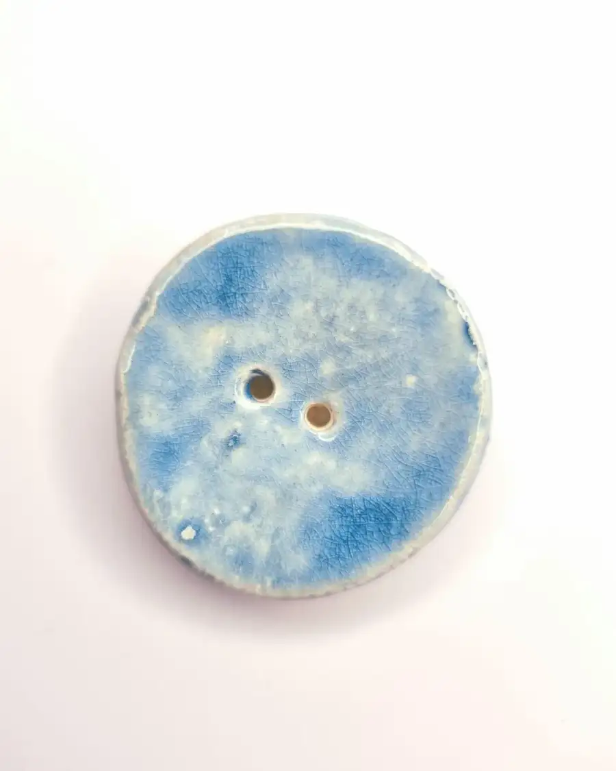 Ceramic button