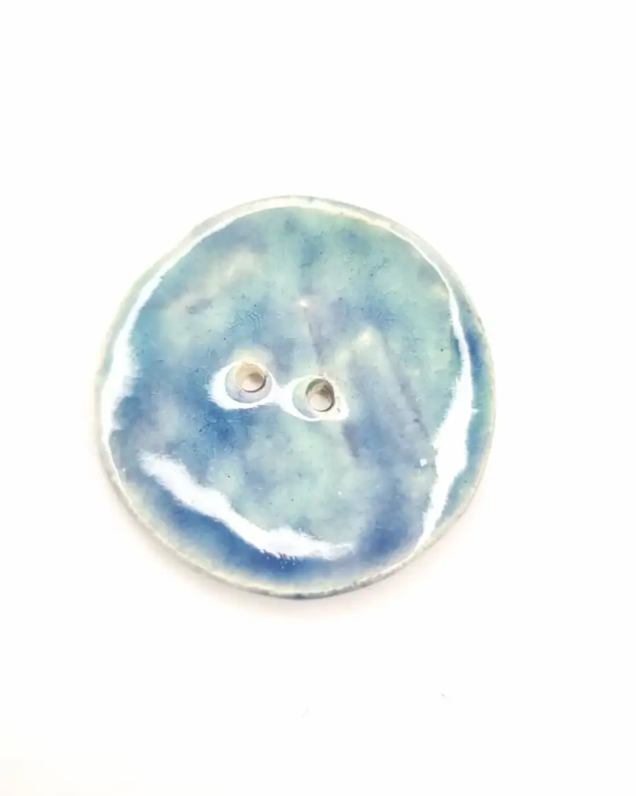 Ceramic button