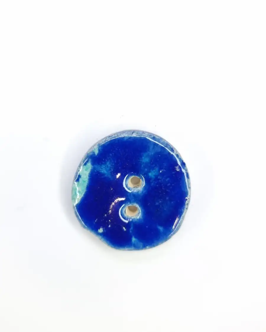 Ceramic button