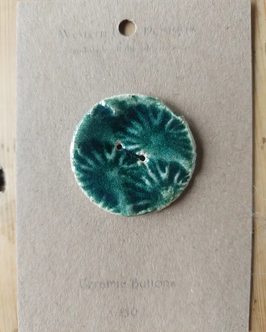 Ceramic button