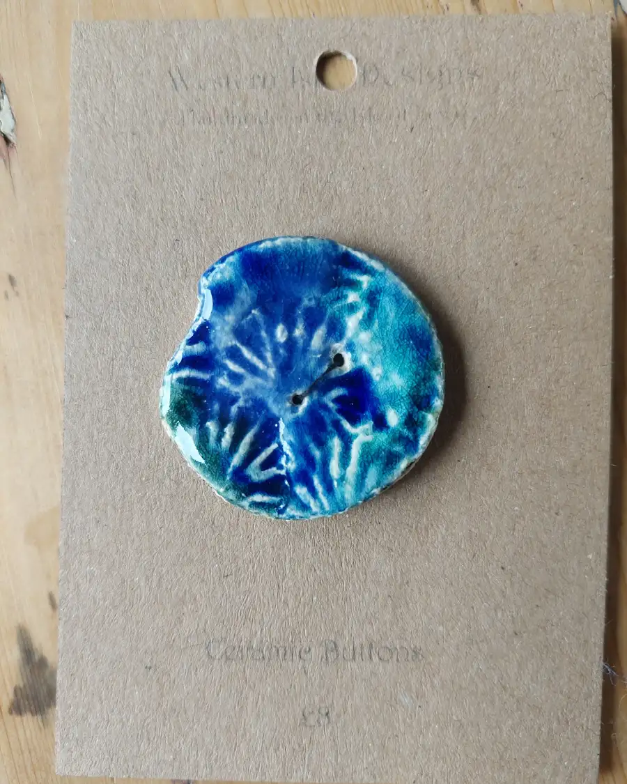Ceramic button