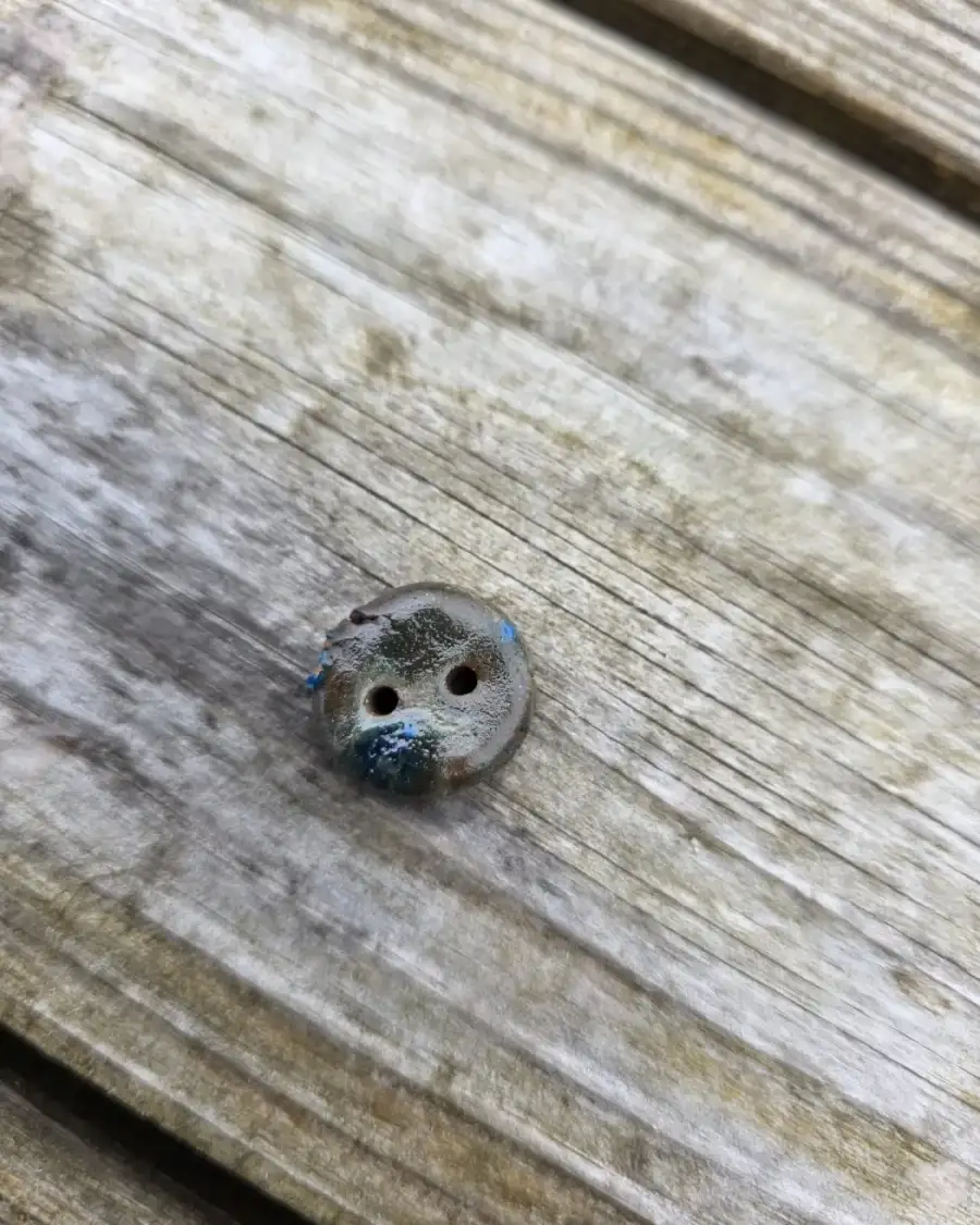 Ceramic button